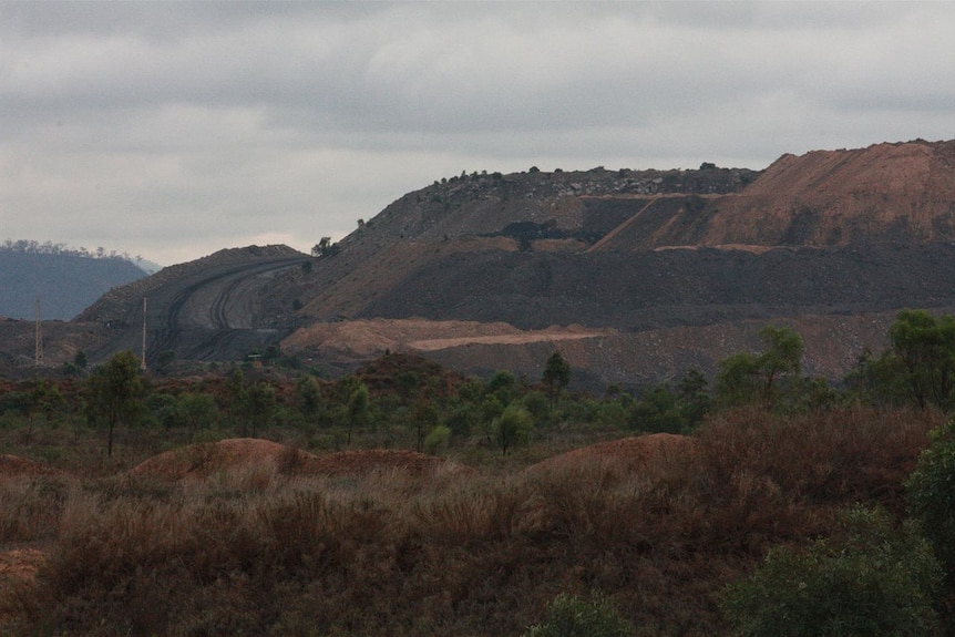 A coal mine in the outback on a bleak-looking day.