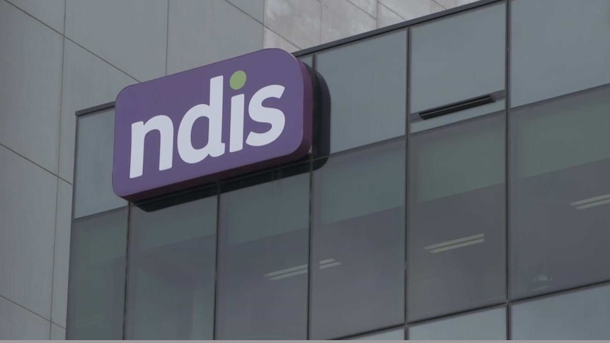 A building with a purple NDIS logo on top