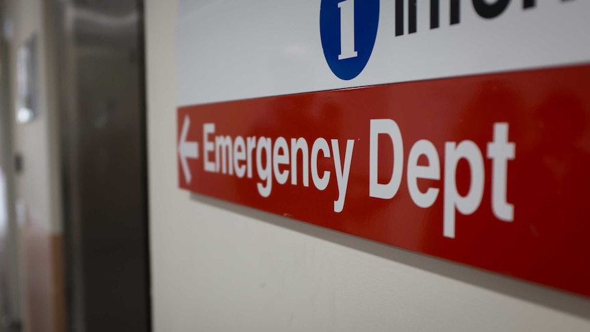 A red sign which reads: "Emergency Dept"