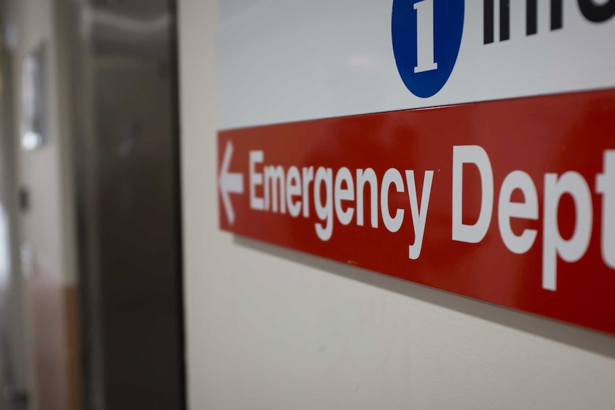 A red sign which reads: "Emergency Dept"