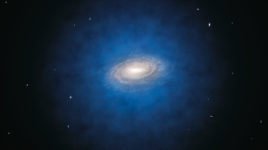 A spiral galaxy surrounded by a blue glow