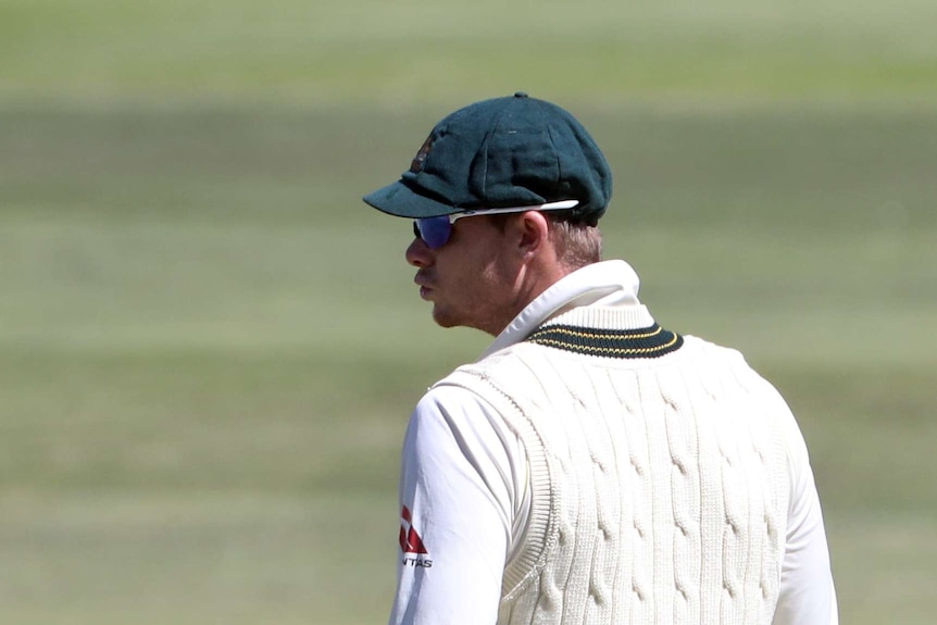 Steve Smith looks to his left while fielding for Australia on day four in Cape Town.