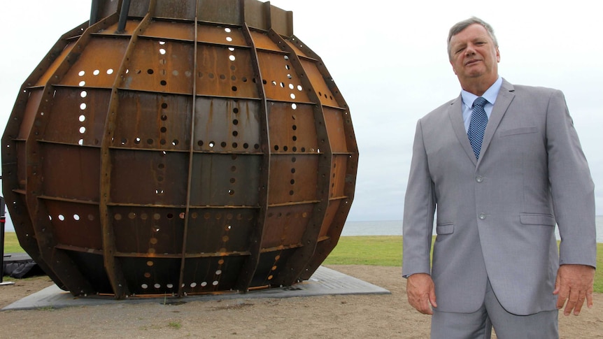 Union leader Gary Keane stands at the Dilfram Dispute monument in Port Kembla.