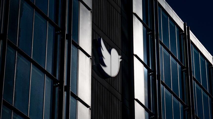 The Twitter logo is seen on the outside of a building