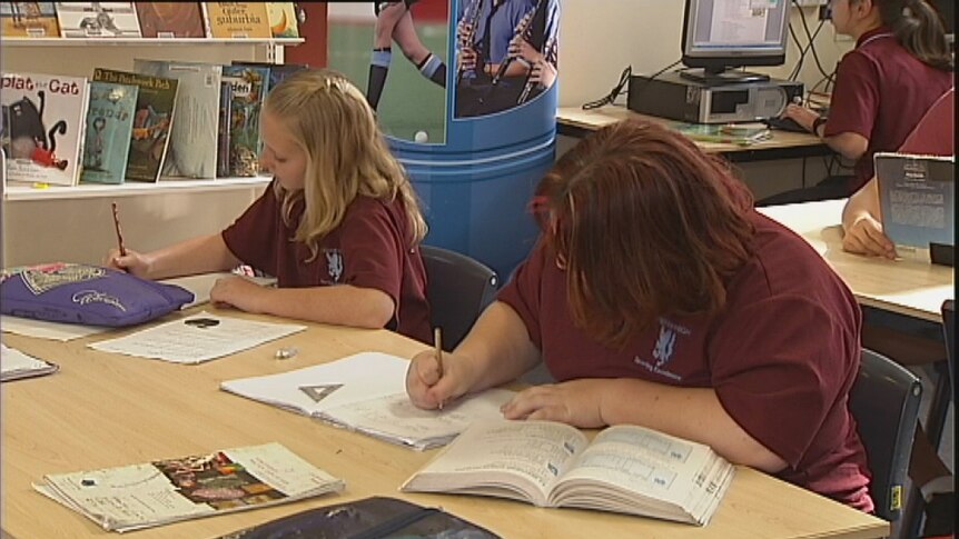 Video still: Unidentified high school students writing in exercise books Generic 2012