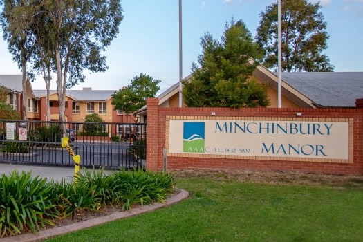 The exterior of a gated aged care home.