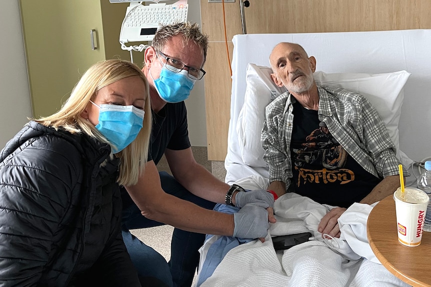 Mark Kilian and his wife Anneli Gericke with Mark's dying father Frans in a hospital room