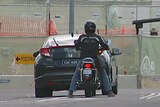 Motorcycles will be able to move to the side of cars stopped at lights under the trial.