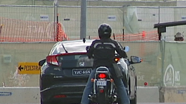Motorcycles will be able to move to the side of cars stopped at lights under the trial.