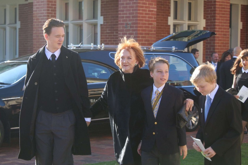 Former wife Eileen Bond arrives at the funeral