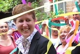 Sally McManus is showered in streamers by community workers