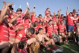 a rugby league team celebrate a win