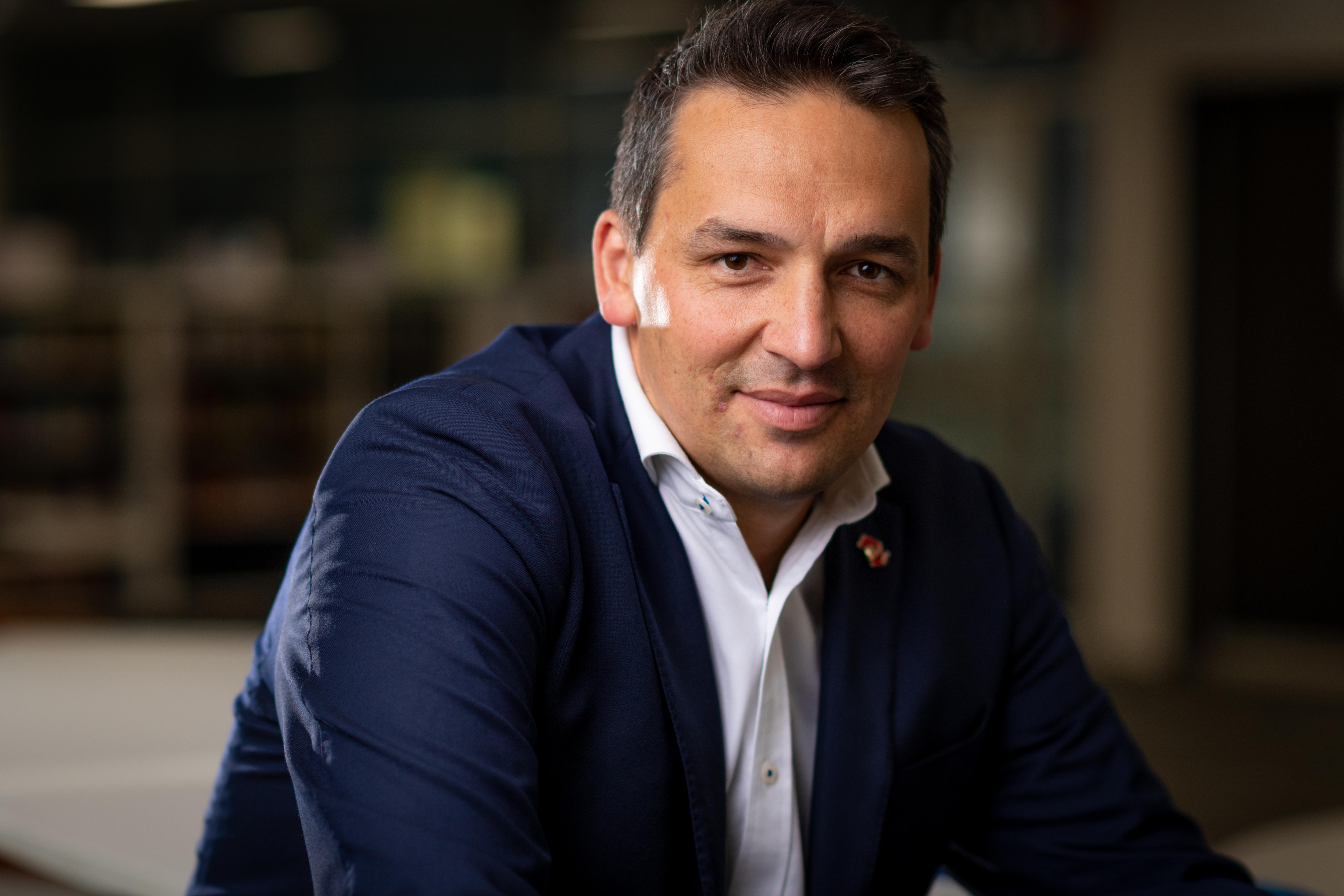 Blair Boyer leaning forward with a neutral expression on his face