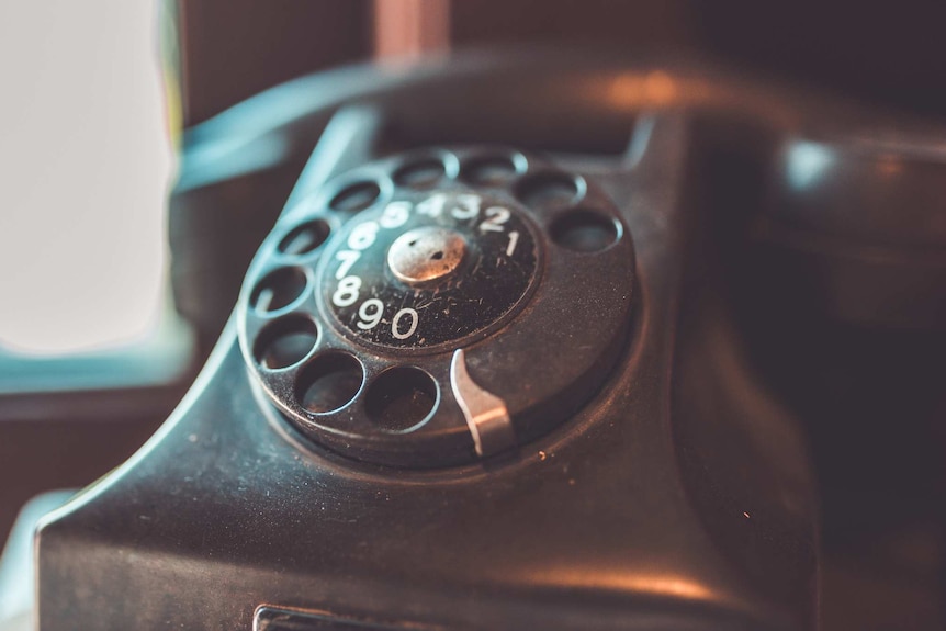 A rotary Bakelite telephone