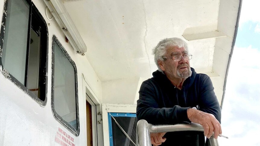 Peter Woods, who is skipper of the Silver Phoenix, stands on deck.