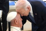US president Joe Biden touches head with Pope Francis 