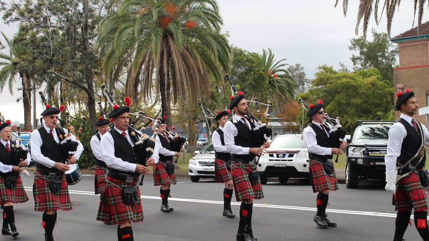 Tom marching