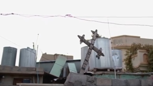 A Cross lies in rubble in northern Iraq