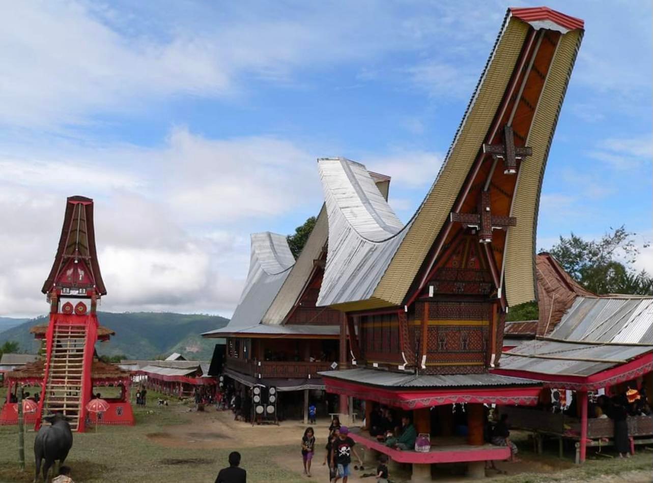 A wooden house with a boat shaped roof.