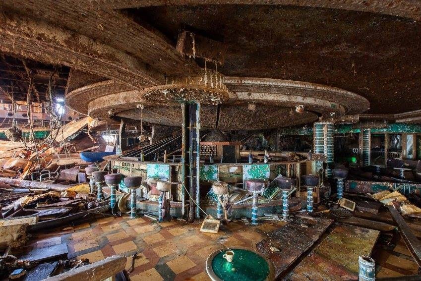 Water-damaged bar area, with debris strewn everywhere.