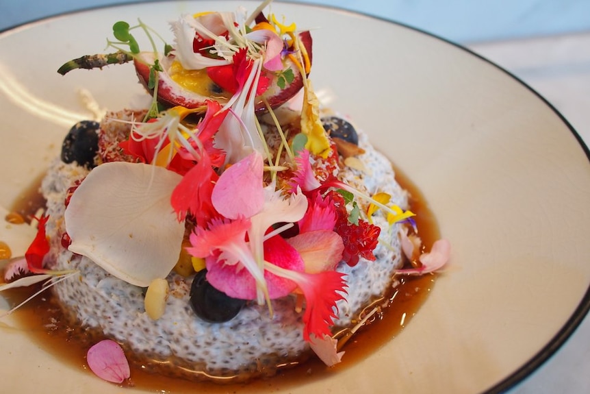 A plate of desert littered with flower petals