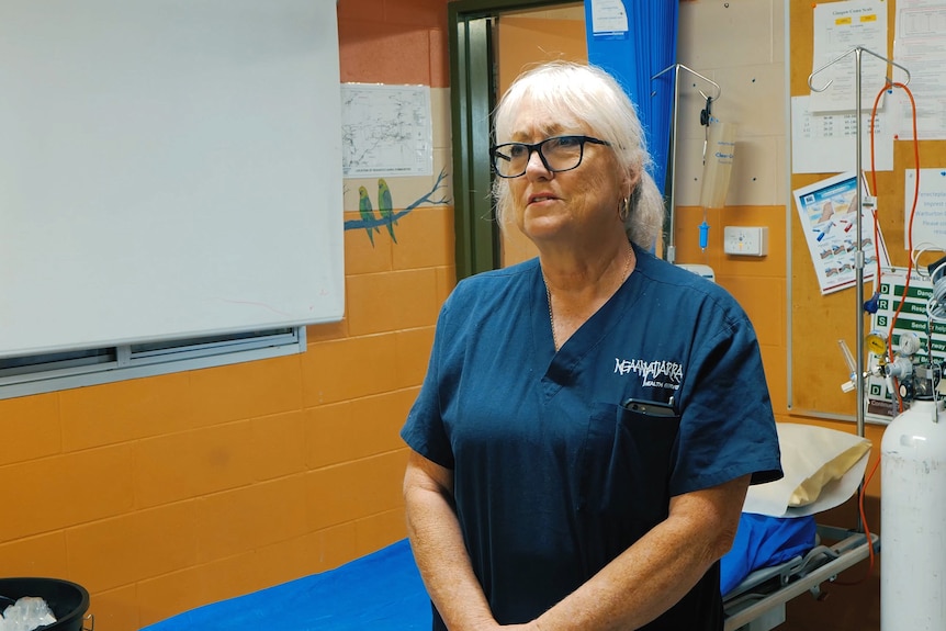 Nurse dressed in scrubs.