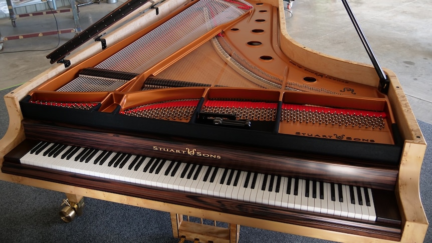 Stuart and Sons 108 key 9 octave piano from a high angle