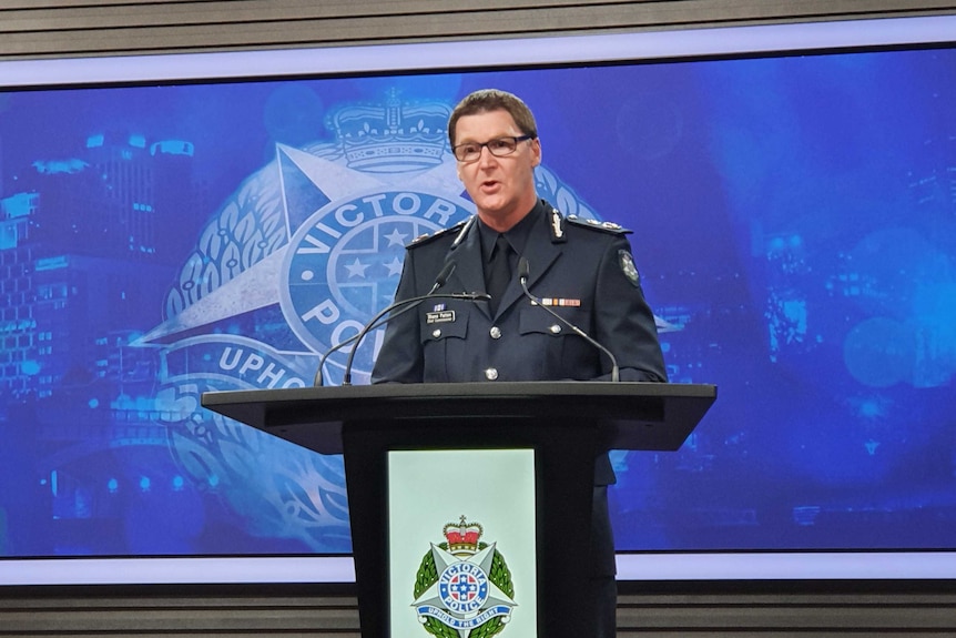 Victoria Police Chief Commissioner Shane Patton addresses a media conference, he is standing at a podium in full uniform.