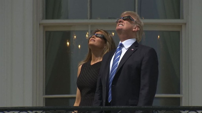Donald Trump watches solar eclipse