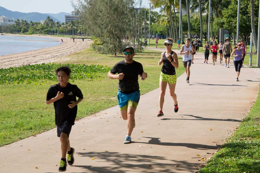Runners and walkers make their way along the Cairns Esplanade during the 2016 Rare Diseases Day fun run in Cairns.