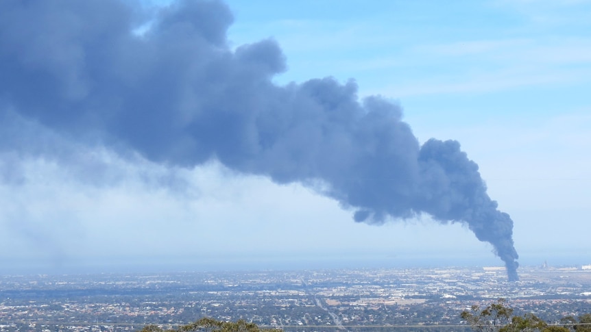 An industrial fire at Wingfield sends plume skywards.