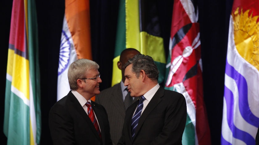 Keeping a high profile: Kevin Rudd meets British Prime Minister Gordon Brown at CHOGM