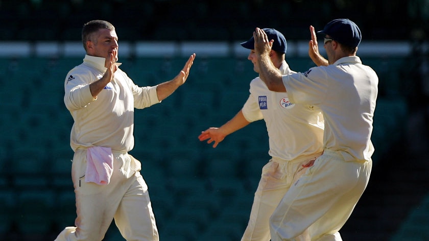 Key wickets... Stuart MacGill dismissed Hodge and Crossthwaite.