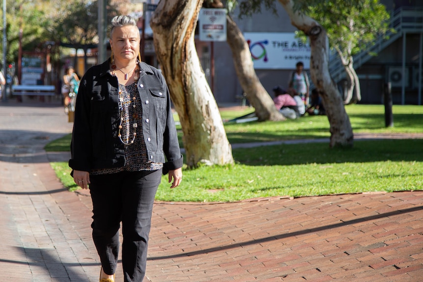 Carolyn Cartwright walks on a footpath.