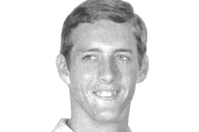 Black and white headshot photo of Ian Stewart, early in his career in the Queensland Police Service, date unknown.