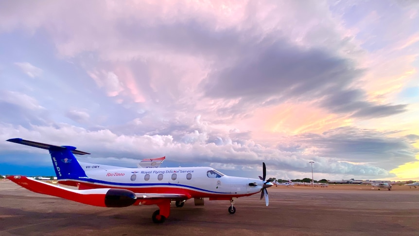 red, white and blue jet on the tarmac in Broome