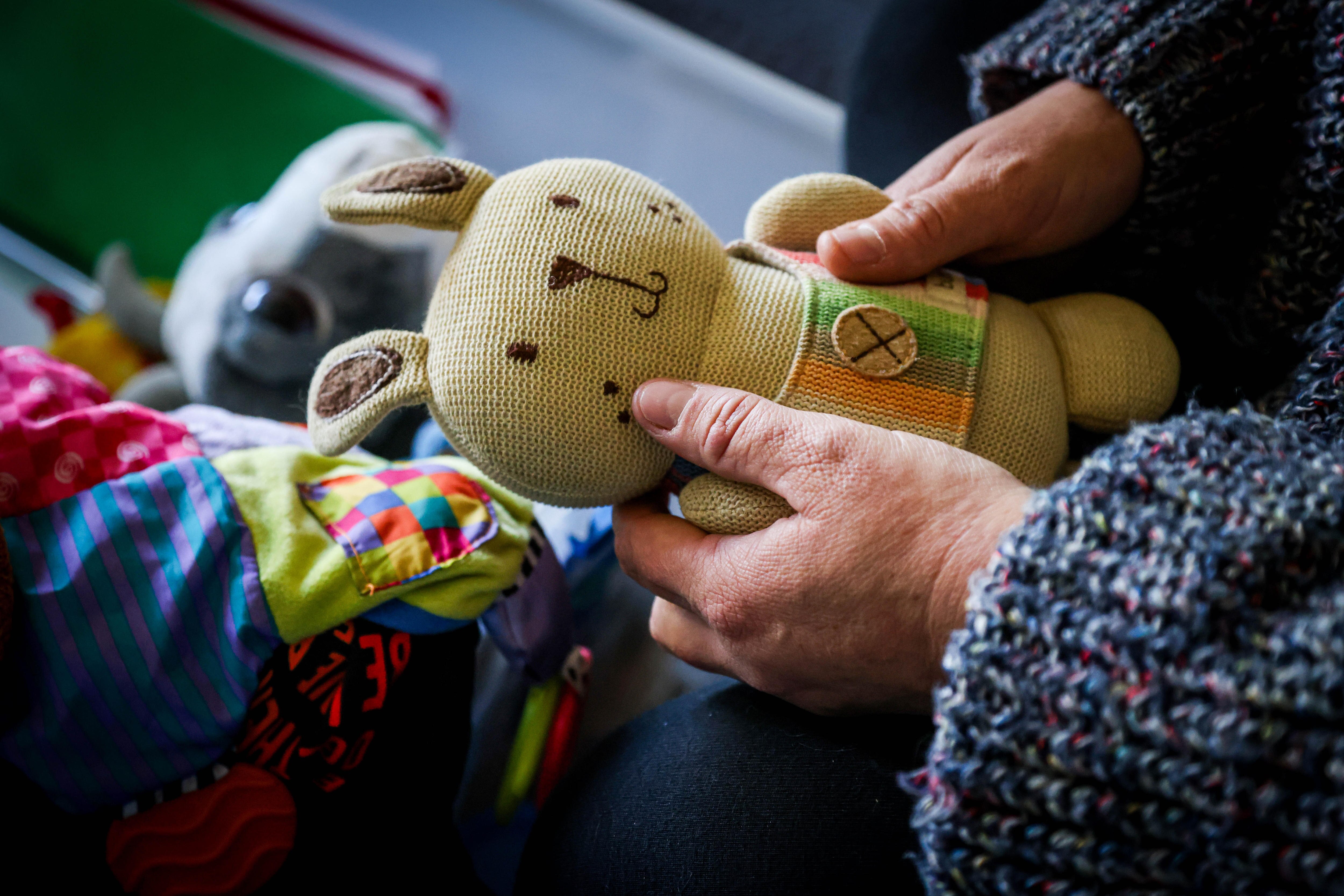 Ella holding a toy that belonged to Jesse when he was little.