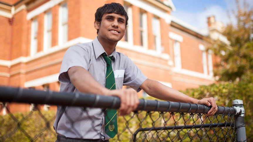 Year 12 student Uriah Daisy outside his school in Coolgardie, WA.