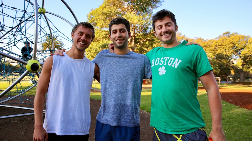 Three men in a park.