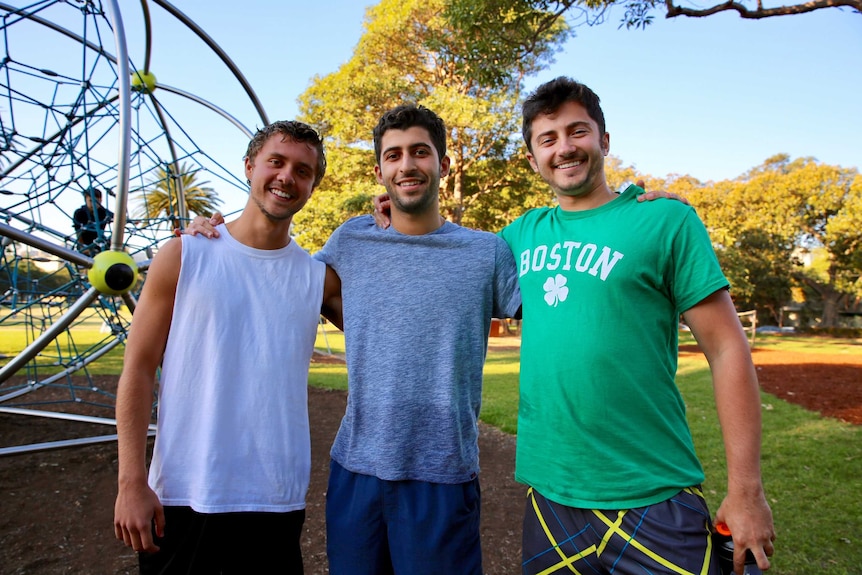 Three men in a park.