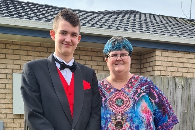 Lachlan dressed for his formal with his mum Chantelle Gardner-Hudson, outside their home.