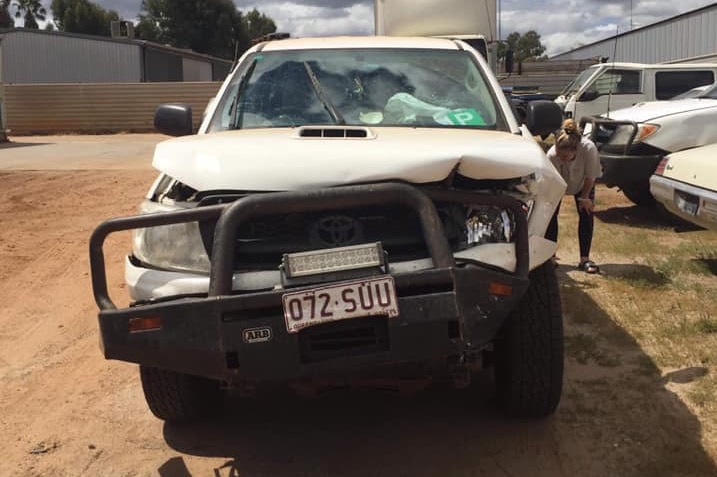 Photo of ute with crushed bonnet and kangaroo bar.