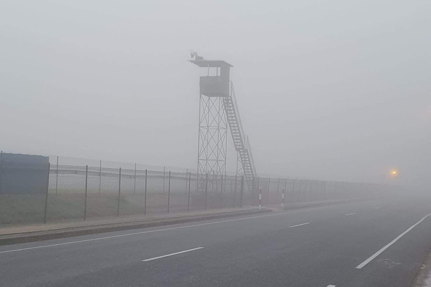 Fog over a street and a booth