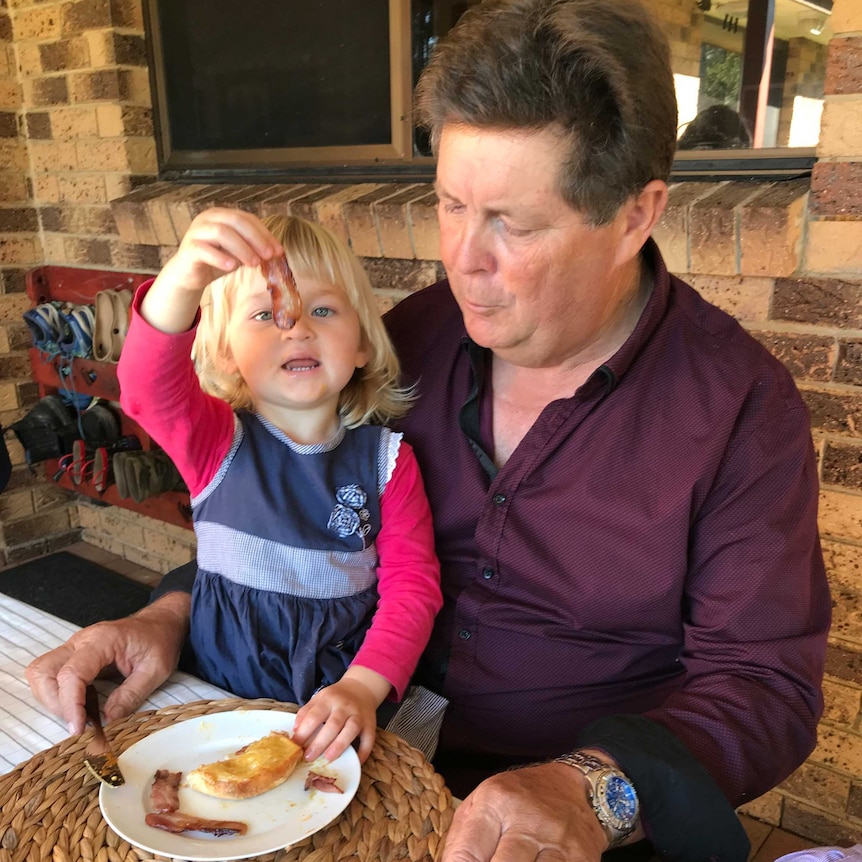 Wayne Douglas having breakfast with his daughter