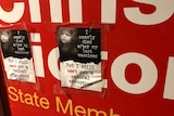 Anti-vaxxer posters on the office of Labor MP Chris Picton.