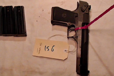 a handgun lies on a table