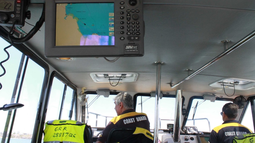 two men in boat cabin