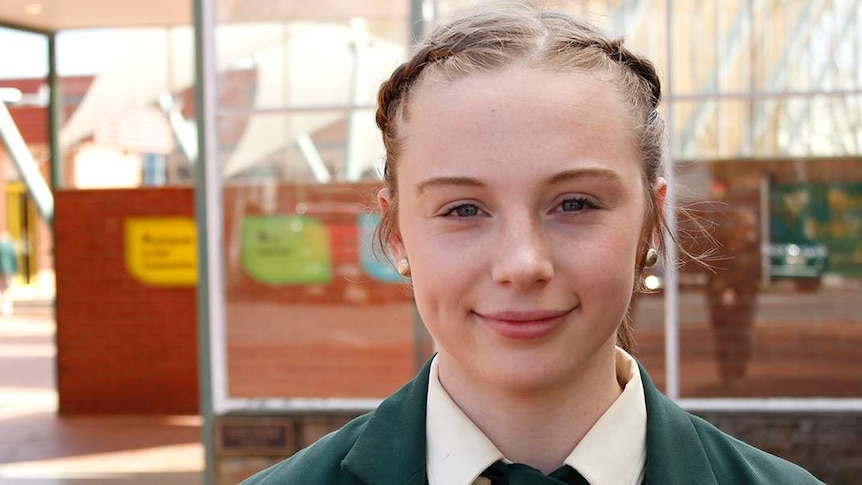 Ella Digney smiles for the camera wearing a St Patricks College uniform.