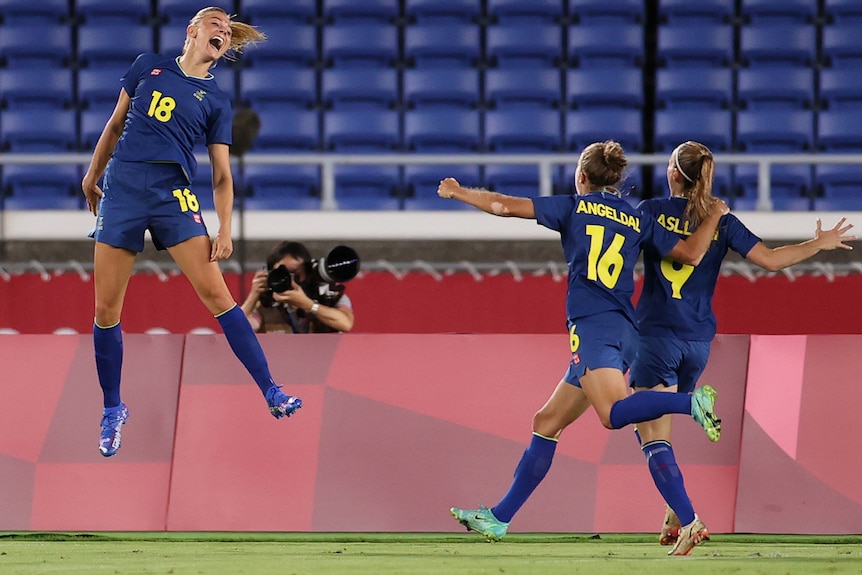 Sweden's women footballers celebrate a goal against Australia.