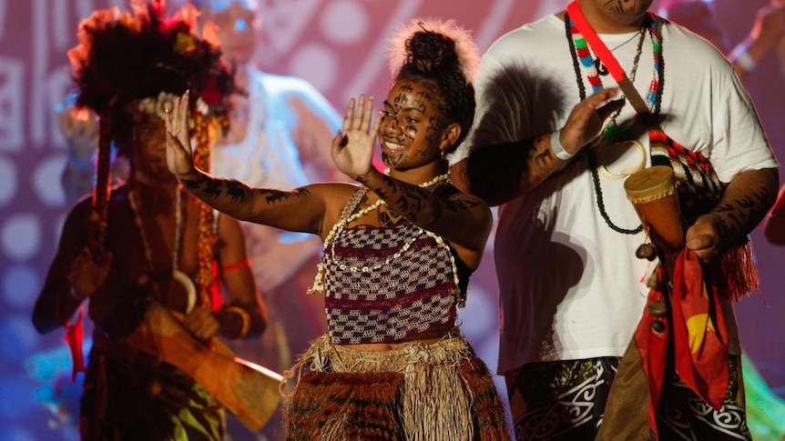 Women dance onstage.